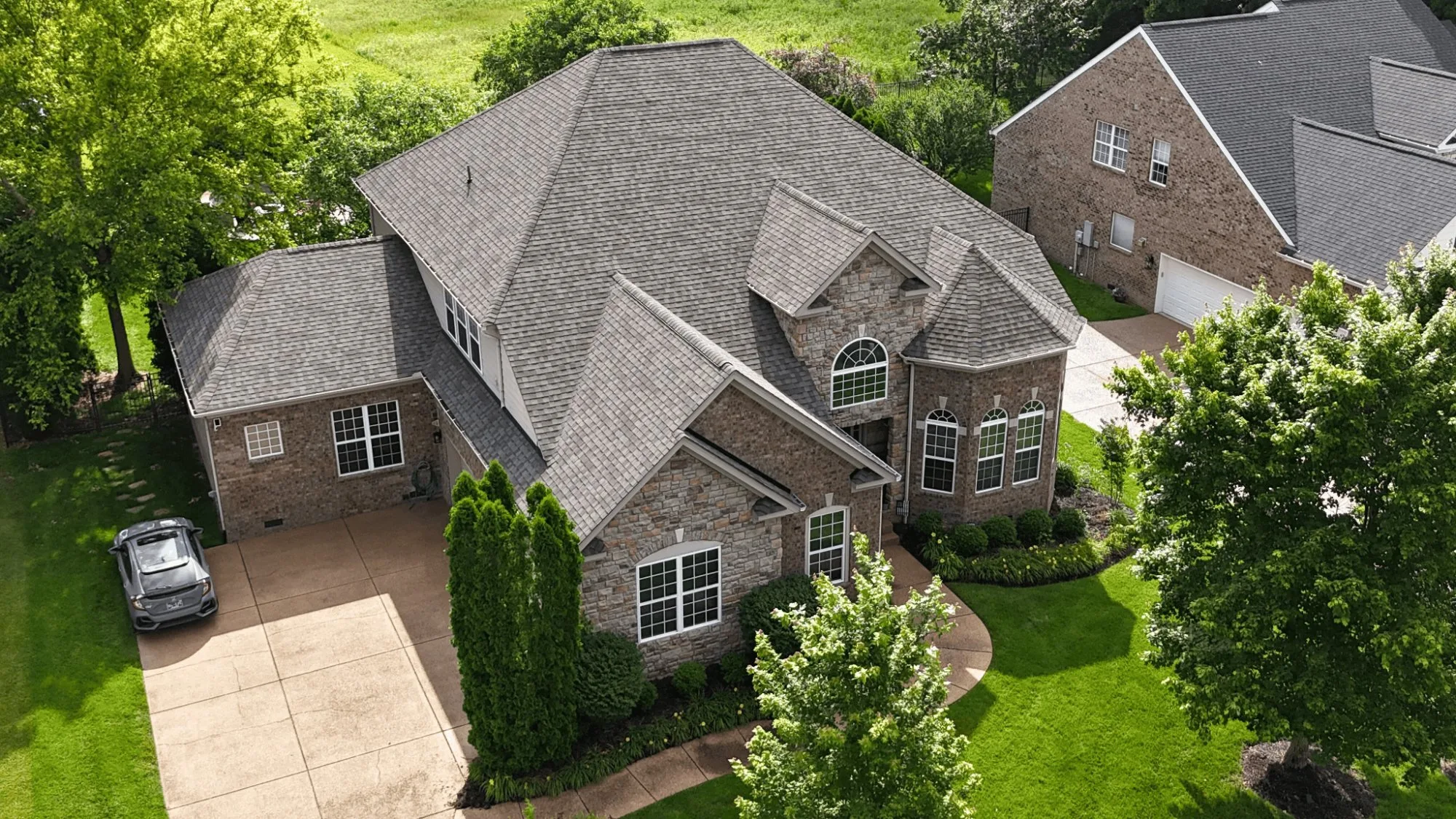 Wind lifted shingles on residential roof
